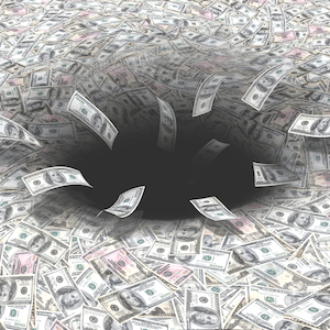 Church or Charity Losing income. Picture of dollars falling into a black hole.
