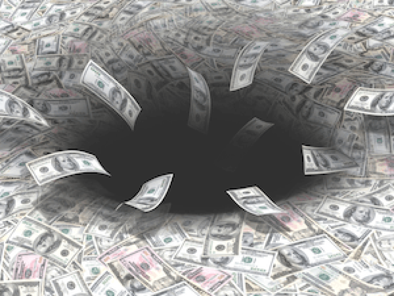 Church or Charity Losing income. Picture of dollars falling into a black hole.
